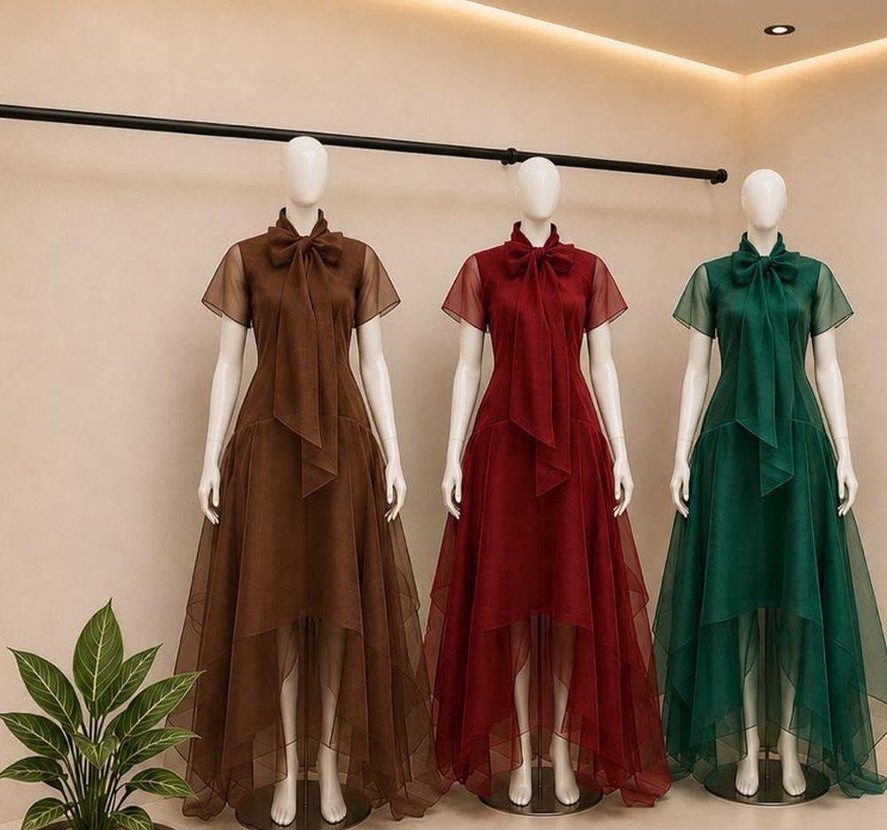 The Signature Bow Dress in brown, red, and green organza